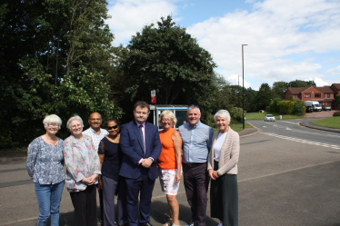 Cllr Gary Ridley (centre) with Cllr Julia Lepoidevin (wearing orange) next to Cllr Peter Male. It was taken with residents and representatives of the Allesley Green Residents Association at the bus stop on Woodridge Avenue (17/7/23). 